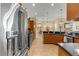 The bright kitchen offers stainless steel appliances, granite counters, and a functional design for easy meal preparation at 2358 Nw 59Th Ter, Ocala, FL 34482