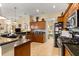 The spacious kitchen boasts granite countertops, modern appliances, and plenty of storage, perfect for culinary enthusiasts at 2358 Nw 59Th Ter, Ocala, FL 34482