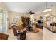 Spacious living area featuring a ceiling fan, stylish décor, and seamless flow to the outdoor pool area at 2358 Nw 59Th Ter, Ocala, FL 34482