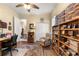 Well-lit office space with display shelves, ceiling fan, and comfortable seating at 2358 Nw 59Th Ter, Ocala, FL 34482