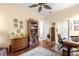 Well-lit office space with display shelves, ceiling fan, and comfortable seating at 2358 Nw 59Th Ter, Ocala, FL 34482