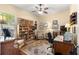 Well-lit office space with display shelves, ceiling fan, and comfortable seating at 2358 Nw 59Th Ter, Ocala, FL 34482