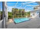 Private backyard oasis with a sparkling pool, screened enclosure, and ample deck space for lounging at 2358 Nw 59Th Ter, Ocala, FL 34482