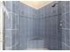 The corner shower showcases blue tiling and built-in seating at 2358 Nw 59Th Ter, Ocala, FL 34482
