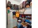 An organized storage room with ample shelving, file cabinets, and storage for luggage and other personal items at 2358 Nw 59Th Ter, Ocala, FL 34482