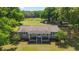 Attractive single-story home with a covered porch, situated on a large lot surrounded by mature trees at 2720 Se 145Th St, Summerfield, FL 34491