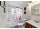 Bathroom with a shower-tub combination and a dark wood vanity at 2720 Se 145Th St, Summerfield, FL 34491