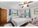Bedroom featuring a ceiling fan and bright windows at 2720 Se 145Th St, Summerfield, FL 34491