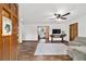 View of a welcoming living room featuring an open layout, hardwood floors, and a cozy seating area at 2720 Se 145Th St, Summerfield, FL 34491