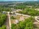 Scenic aerial view of a home nestled amidst lush greenery and a vast open landscape at 2800 Sw 141St Ct, Ocala, FL 34481