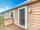 Charming deck featuring a storm door and natural light with a view into the home at 2800 Sw 141St Ct, Ocala, FL 34481