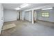 Unfinished basement space featuring neutral carpet and open layout, ready for customization at 2800 Sw 141St Ct, Ocala, FL 34481