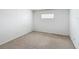 Neutral carpeted room in the basement featuring a glass block window at 2800 Sw 141St Ct, Ocala, FL 34481