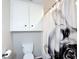 Bathroom featuring toilet, built-in white storage cabinet, and quirky shower curtain at 2800 Sw 141St Ct, Ocala, FL 34481
