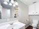 Bathroom showcasing vanity with large mirror, overhead lighting, and built-in storage at 2800 Sw 141St Ct, Ocala, FL 34481
