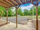 Covered porch with gravel driveway and natural views at 2800 Sw 141St Ct, Ocala, FL 34481