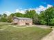 Beautiful exterior view of this two-story home with lovely landscaping, deck, and a gravel drive at 2800 Sw 141St Ct, Ocala, FL 34481
