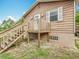 Close up exterior of a two story home with wooden deck and white trim at 2800 Sw 141St Ct, Ocala, FL 34481