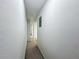 Hallway with beige carpet leading to other rooms at 2800 Sw 141St Ct, Ocala, FL 34481