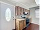 An updated kitchen with wood cabinets, stainless steel appliances and a tiled backsplash at 2800 Sw 141St Ct, Ocala, FL 34481