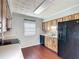 This kitchen features wood-look cabinets, light countertops, and stainless steel appliances at 2800 Sw 141St Ct, Ocala, FL 34481