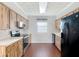 This beautifully renovated kitchen features modern appliances, wooden cabinets, and stunning countertops at 2800 Sw 141St Ct, Ocala, FL 34481
