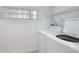 Close up of white laundry machines in small laundry room at 2800 Sw 141St Ct, Ocala, FL 34481