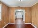 View of kitchen from inside a room with wood paneling through an archway at 2800 Sw 141St Ct, Ocala, FL 34481