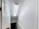 Image shows the interior stairway with a long light fixture at 2800 Sw 141St Ct, Ocala, FL 34481