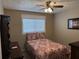 Cozy bedroom showcasing a comfortable bed, window, and matching furniture for a harmonious retreat at 3021 Se 5Th Ter # A, Ocala, FL 34471