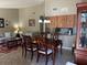 Inviting dining room and living room space featuring an elegant dining set and comfortable seating area at 3021 Se 5Th Ter # A, Ocala, FL 34471