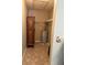 Small utility room contains a water heater and antique wood cabinet at 3021 Se 5Th Ter # A, Ocala, FL 34471