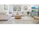 Bright living room features a plush sectional sofa, round ottoman and stylish decor at 3736 Sw 158Th Street Rd, Ocala, FL 34473