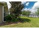 A spacious, green backyard is enclosed by a black fence, providing a secure and private outdoor area at 4945 Nw 35Th Lane Rd, Ocala, FL 34482