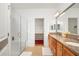 Modern bathroom with a glass-enclosed shower and double vanity at 4945 Nw 35Th Lane Rd, Ocala, FL 34482
