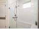Modern bathroom featuring glass-enclosed shower with white subway tile and built-in bench seating at 4945 Nw 35Th Lane Rd, Ocala, FL 34482