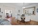 Dining room with round table, elegant chairs, and a view to an office and the living room at 4945 Nw 35Th Lane Rd, Ocala, FL 34482