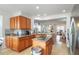 Open kitchen with stainless steel appliances and a view into the living room at 4945 Nw 35Th Lane Rd, Ocala, FL 34482