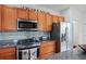Modern kitchen with stainless steel appliances and granite countertops at 4945 Nw 35Th Lane Rd, Ocala, FL 34482