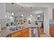Open-concept kitchen with granite countertops and a breakfast nook at 4945 Nw 35Th Lane Rd, Ocala, FL 34482