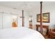 Spacious main bedroom with a four-poster bed, ensuite bathroom and ample natural light at 4945 Nw 35Th Lane Rd, Ocala, FL 34482