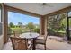 The screened porch offers an outdoor dining area with comfortable seating and views of the beautifully maintained yard at 4945 Nw 35Th Lane Rd, Ocala, FL 34482