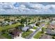 Aerial view of a single-Gathering home in a well-maintained neighborhood with a beautiful golf course at 5195 Nw 21St Loop, Ocala, FL 34482