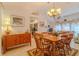 Bright dining room with wood furnishings, tile flooring, and views into the adjacent kitchen and living areas at 5195 Nw 21St Loop, Ocala, FL 34482