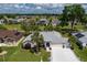 Beautiful single-story home with mature landscaping, large driveway, and attached two car garage at 5195 Nw 21St Loop, Ocala, FL 34482