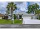 Charming single-story home with well-maintained landscaping, a three-car garage, and inviting curb appeal at 5195 Nw 21St Loop, Ocala, FL 34482