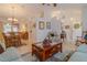 Open-concept living space with neutral decor, tile flooring, and an adjacent dining area at 5195 Nw 21St Loop, Ocala, FL 34482