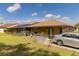A well-maintained backyard featuring an inviting screened-in pool and fenced yard at 5770 Sw 89Th Pl, Ocala, FL 34476