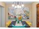 Dining room with unique chandelier and bright decor at 5770 Sw 89Th Pl, Ocala, FL 34476