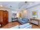 Comfortable living room with soft blue couch, wardrobe, and stylish table at 5770 Sw 89Th Pl, Ocala, FL 34476